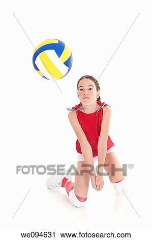 Cute Caucasian girl hitting the ball in volleyball View Large Photo Image Stock Image - Cute Caucasian girl hitting the ball in volleyball. Fotosearch