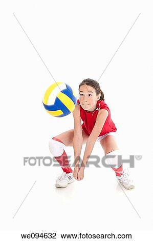 Cute Caucasian girl hitting the ball in volleyball View Large Photo Image Stock Image - Cute Caucasian girl hitting the ball in volleyball. Fotosearch
