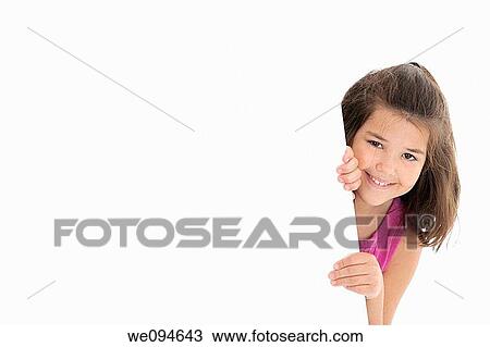 Stock Image - Cute Caucasian girl holding a blank sign. Fotosearch