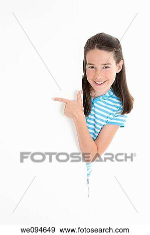 Stock Photo - Cute Caucasian girl holding a blank sign. Fotosearch