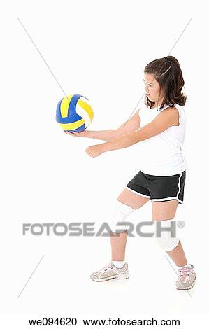Cute Caucasian girl serving the ball in volleyball View Large Photo Image Stock Image - Cute Caucasian girl serving the ball in volleyball. Fotosearch