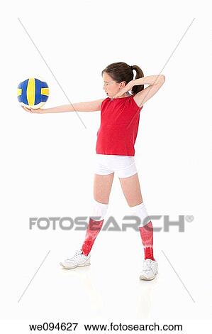 Cute Caucasian girl serving the ball in volleyball View Large Photo Image Stock Photo - Cute Caucasian girl serving the ball in volleyball. Fotosearch