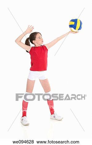 Cute Caucasian girl serving the ball in volleyball View Large Photo Image Stock Photo - Cute Caucasian girl serving the ball in volleyball. Fotosearch