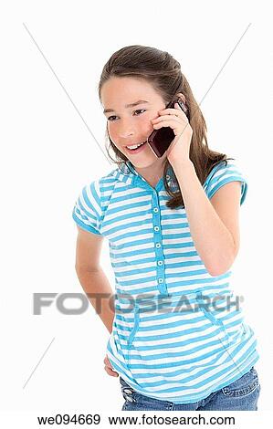 Cute Caucasian girl talking on a cell phone View Large Photo Image Stock Photo - Cute Caucasian girl talking on a cell phone. Fotosearch