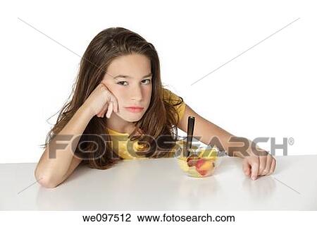 Cute Caucasian girl that very unhappy that she has to eat fruit View Large Photo Image Stock Image - Cute Caucasian girl that very unhappy that she has to eat fruit. Fotosearch