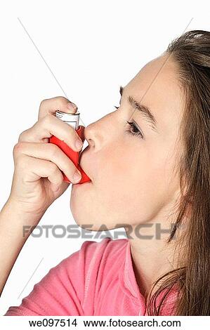 Cute Caucasian girl using an inhaler for Asthma View Large Photo Image Picture - Cute Caucasian girl using an inhaler for Asthma. Fotosearch