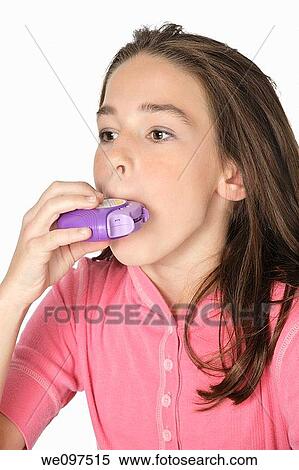 Cute Caucasian girl using an inhaler for Asthma View Large Photo Image Stock Photography - Cute Caucasian girl using an inhaler for Asthma. Fotosearch