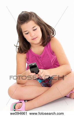 Cute Caucasian girls texting on a cell phone View Large Photo Image Stock Image - Cute Caucasian girls texting on a cell phone. Fotosearch