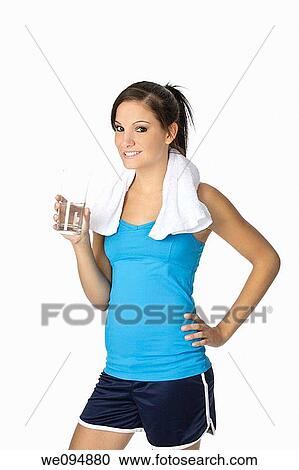 Cute Caucasian woman holding a glass of water on white background View Large Photo Image Stock Image - Cute Caucasian woman holding a glass of water on white background. Fotosearch