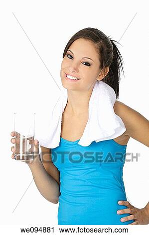 Cute Caucasian woman holding a glass of water on white background View Large Photo Image Stock Image - Cute Caucasian woman holding a glass of water on white background. Fotosearch