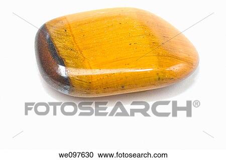 Cutout of a Gold Tiger Eye gemstone on white background View Large Photo Image Stock Image - Cutout of a Gold Tiger Eye gemstone on white background. Fotosearch