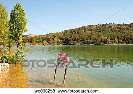 Danger sign. Lagunas de Ruidera Nature Reserve, Ciudad Real province, Castilla La Mancha, Spain. View Large Photo Image Stock Photo - Danger sign. Lagunas de Ruidera Nature Reserve, Ciudad Real province, Castilla La Mancha, Spain.. Fotosearch