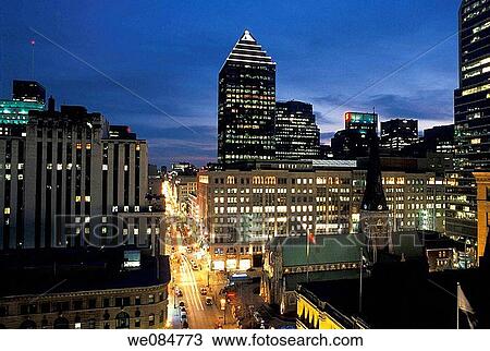Downtown Montreal skyline with view of Sainte-Catherine street at dusk, Quebec, Canada View Large Photo Image Stock Image - Downtown Montreal skyline with view of Sainte-Catherine street at dusk, Quebec, Canada. Fotosearch