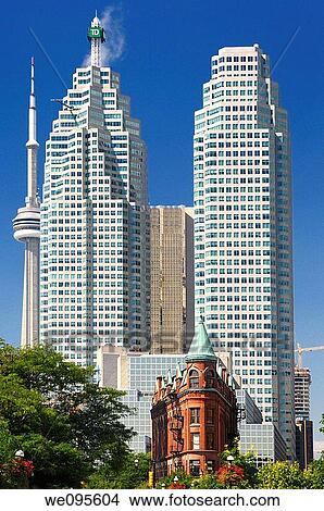 Downtown Toronto financial skyscrapers and CN tower dwarfs historic red brick Flatiron building View Large Photo Image Picture - Downtown Toronto financial skyscrapers and CN tower dwarfs historic red brick Flatiron building. Fotosearch