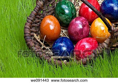 Easter eggs in a basket / Ostereier im Korb View Large Photo Image Stock Image - Easter eggs in a basket / Ostereier im Korb. Fotosearch