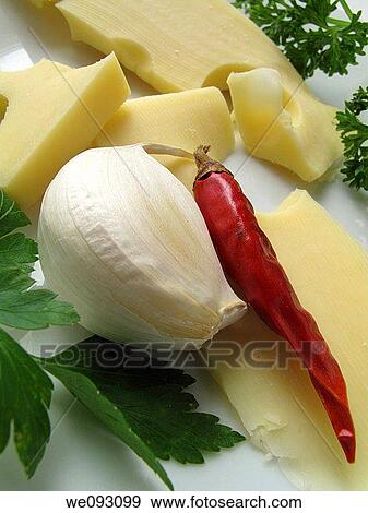 Emmental cheese with garlic and paprika View Large Photo Image Stock Photo - Emmental cheese with garlic and paprika. Fotosearch