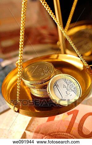 Euro coins in pan of weighing balance View Large Photo Image Picture - Euro coins in pan of weighing balance. Fotosearch