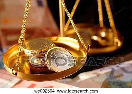 Euro coins in pan of weighing balance View Large Photo Image Picture - Euro coins in pan of weighing balance. Fotosearch