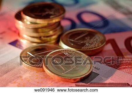 Stock Photograph - Euro coins on euro notes. Fotosearch