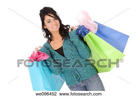 Excited Caucasian woman holding shopping bags and smiling on white background View Large Photo Image Stock Image - Excited Caucasian woman holding shopping bags and smiling on white background. Fotosearch