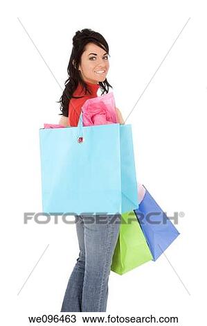 Excited Caucasian woman holding shopping bags and smiling on white background View Large Photo Image Stock Image - Excited Caucasian woman holding shopping bags and smiling on white background. Fotosearch