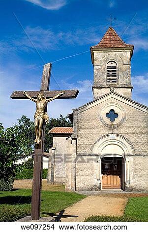 Facade of a church with a cross in the foreground, Mano village, France View Large Photo Image Picture - Facade of a church with a cross in the foreground, Mano village, France. Fotosearch