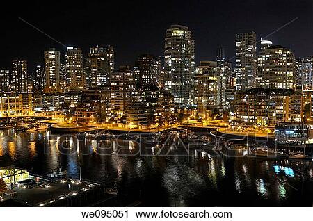 Stock Image - False Creek Yacht Club and West End Vancouver Condominiums at night. Fotosearch