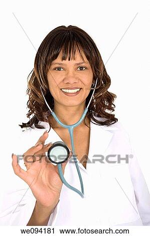 Female African American doctor nurse holding a stethoscope on white background View Large Photo Image Stock Image - Female African American doctor nurse holding a stethoscope on white background. Fotosearch