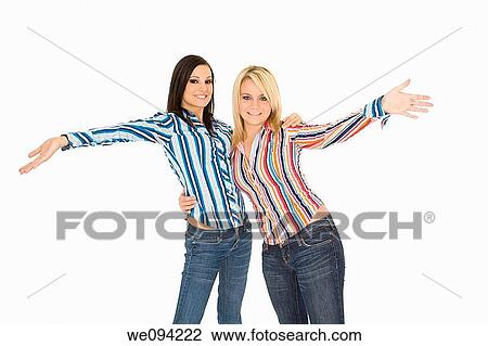 Female Caucasian friends acting silly on white background View Large Photo Image Stock Image - Female Caucasian friends acting silly on white background. Fotosearch
