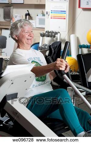 Female heart patient exercising in hospital cardiac rehab fitness center. View Large Photo Image Stock Photo - Female heart patient exercising in hospital cardiac rehab fitness center.. Fotosearch