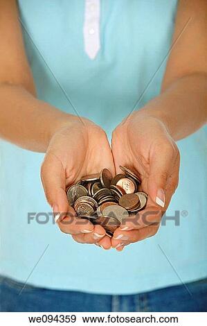 Female holding a hand full of US coins View Large Photo Image Stock Photo - Female holding a hand full of US coins. Fotosearch