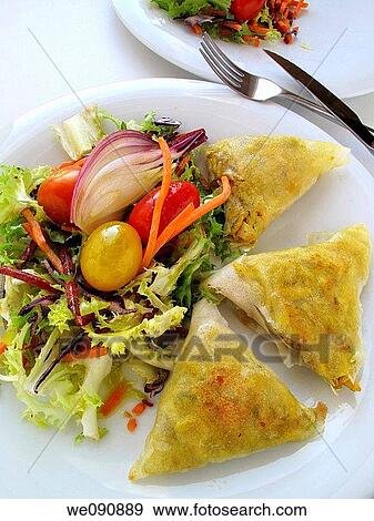 Filo pastry triangles stuffed with rice and meat with salad View Large Photo Image Stock Photo - Filo pastry triangles stuffed with rice and meat with salad. Fotosearch