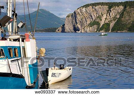 Fishing boat leaving East Arm Bonne Bay at Norris Point at the end of the day with Shag Cliff View Large Photo Image Stock Photo - Fishing boat leaving East Arm Bonne Bay at Norris Point at the end of the day with Shag Cliff. Fotosearch