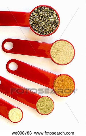 Five red measuring spoons, from a tablespoon to a quarter teaspoon, filled with spices arranged in descending order on a white background Spices include marjoram, ground ginger, curry, thyme, and mustard powder View Large Photo Image Stock Image - Five red measuring spoons, from a tablespoon to a quarter teaspoon, filled with spices arranged in descending order on a white background Spices include marjoram, ground ginger, curry, thyme, and mustard powder. Fotosearch