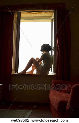 France woman looking out from a window View Large Photo Image Stock Image - France woman looking out from a window. Fotosearch