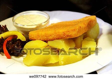 Fried cheese with baked potatoes and sauce Prague Czech republic View Large Photo Image Stock Image - Fried cheese with baked potatoes and sauce Prague Czech republic. Fotosearch