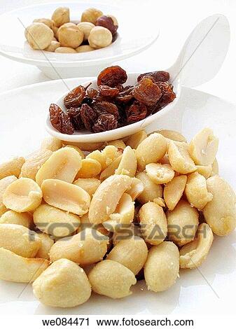 Fried peanuts, raisins and hazelnuts View Large Photo Image Stock Image - Fried peanuts, raisins and hazelnuts. Fotosearch