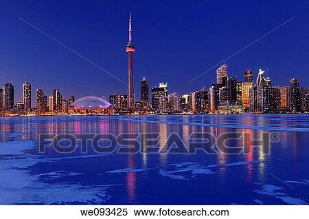 Frozen ice covered Lake Ontario reflecting the lights of Toronto city skyline at dusk View Large Photo Image Stock Photography - Frozen ice covered Lake Ontario reflecting the lights of Toronto city skyline at dusk. Fotosearch