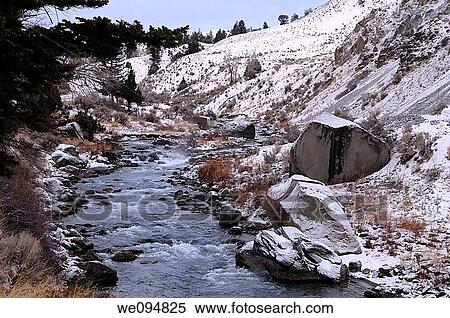 Stock Photography - Gardner River in Yellowstone National Park Montana at dawn after a light snowfall. Fotosearch