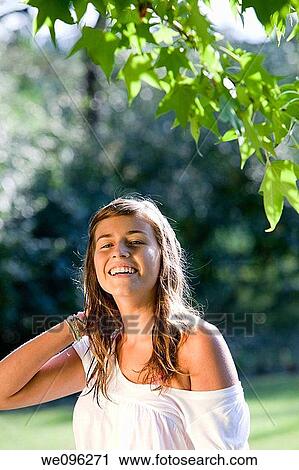 Stock Image - Girl in a garden. Fotosearch