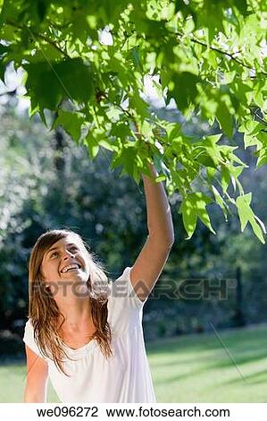 Girl in a garden View Large Photo Image Stock Image - Girl in a garden. Fotosearch