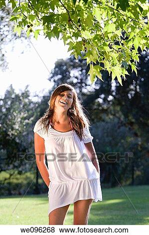 Girl in a garden View Large Photo Image Stock Photo - Girl in a garden. Fotosearch