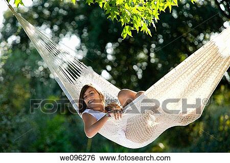 Girl in hammock View Large Photo Image Stock Photograph - Girl in hammock. Fotosearch