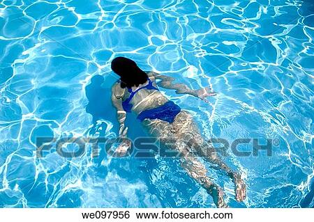 Girl Swimming underwater View Large Photo Image Stock Photograph - Girl Swimming underwater. Fotosearch