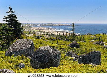 Glacial boulders and rocky coastline at Whalesback with Peggys Cove in distance View Large Photo Image Stock Image - Glacial boulders and rocky coastline at Whalesback with Peggys Cove in distance. Fotosearch