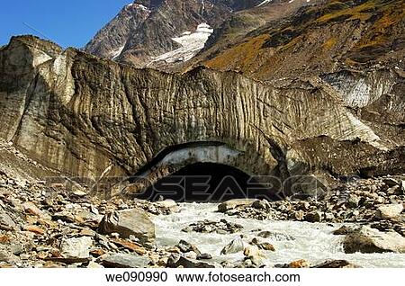 Stock Image - Glacier mouth of the Langgletscher glacier and outflow of the melt water in the river Lonza at the end of the ice front, Loetschental, Valais, Switzerland. Fotosearch