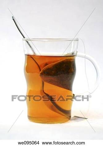 Picture - Glass cup of tea The Tea bag can be seen in the cup. Fotosearch