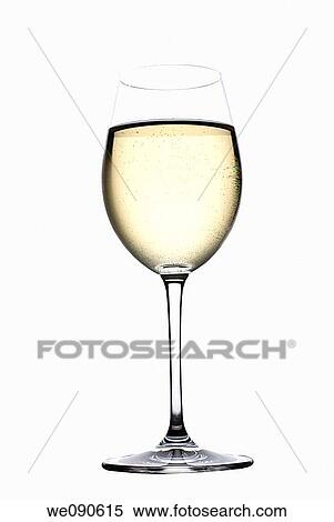 Stock Photography - Glass of white wine, backlit against white background. Fotosearch