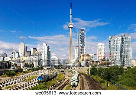 GO and VIA trains leaving downtown Toronto highrise towers after work View Large Photo Image Stock Image - GO and VIA trains leaving downtown Toronto highrise towers after work. Fotosearch
