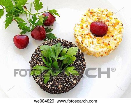 Stock Photo - Goat cheese with black pepper, cherries and pineapple. Fotosearch